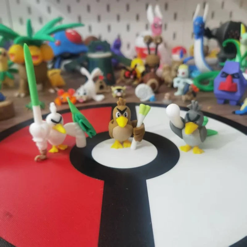 Figurines Pokémon de Canarticho et de son évolution Palarticho avec leur poireau.
