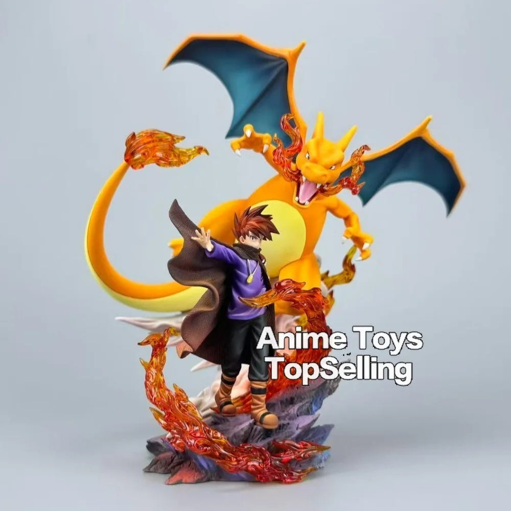 Superbe figurine de collection représentant Dracaufeu aux côtés de son dresseur avec effets de flammes
