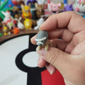 Figurines Pokémon fossiles de Dinoclier et son évolution Bastiodon.