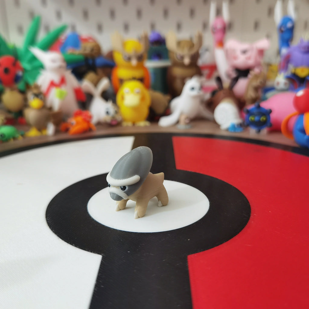 Figurines Pokémon fossiles de Dinoclier et son évolution Bastiodon.
