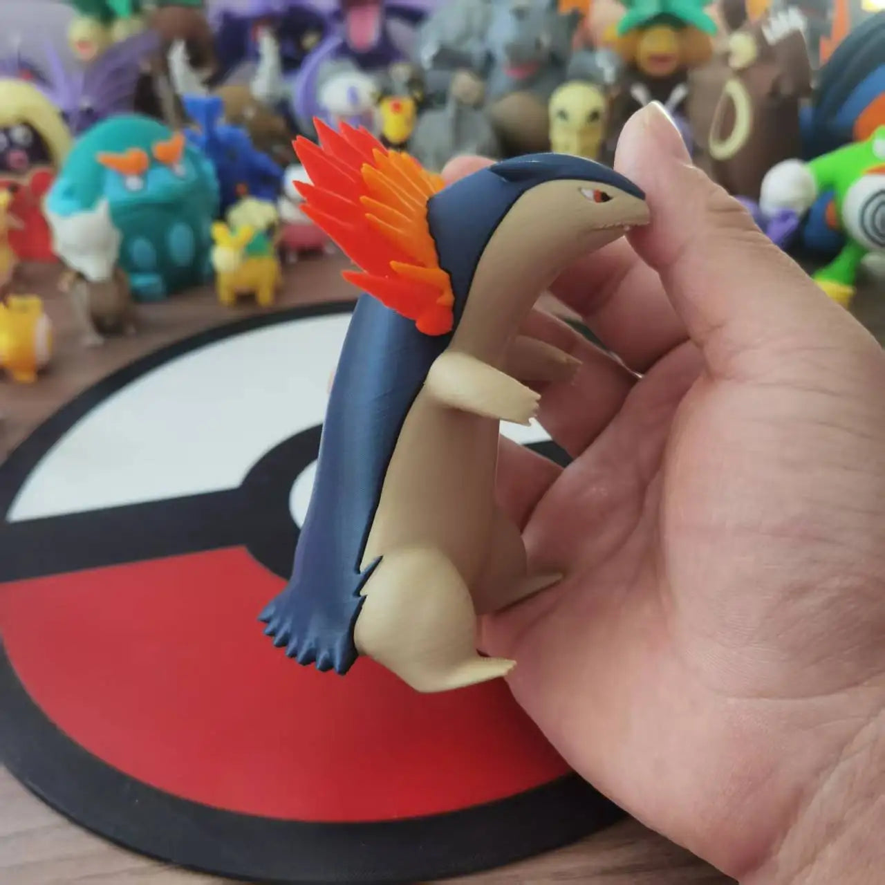 Figurines Pokémon du starter Feu de Johto : Héricendre, Feurisson et Typhlosion.