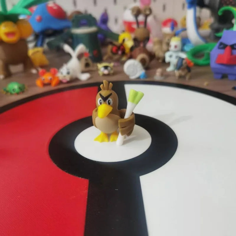 Figurines Pokémon de Canarticho et de son évolution Palarticho avec leur poireau.
