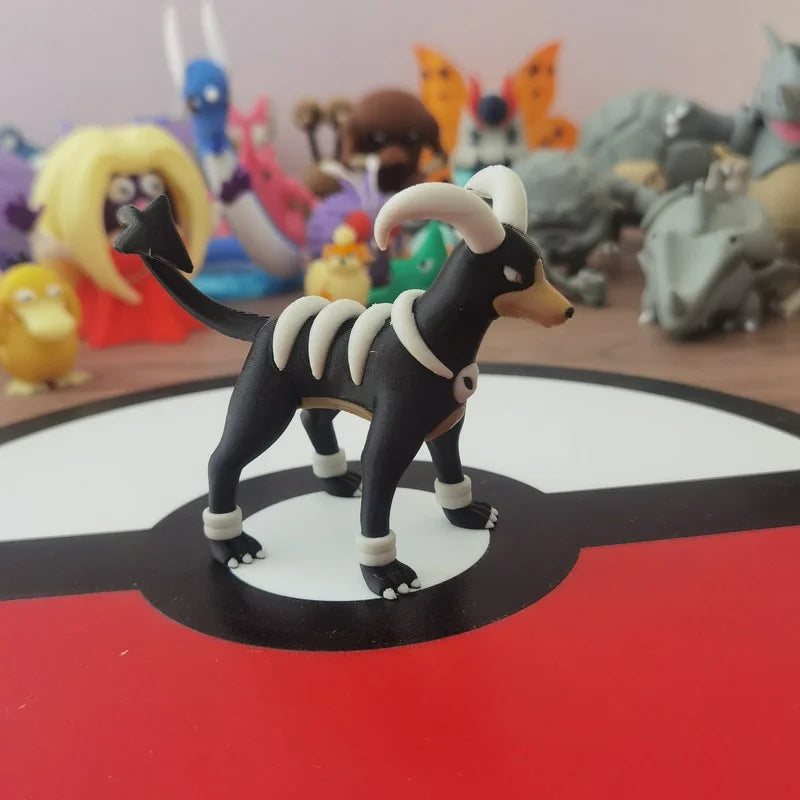 Figurines Pokémon de la ligne évolutive de Malosse, Démolosse et Méga-Démolosse.
