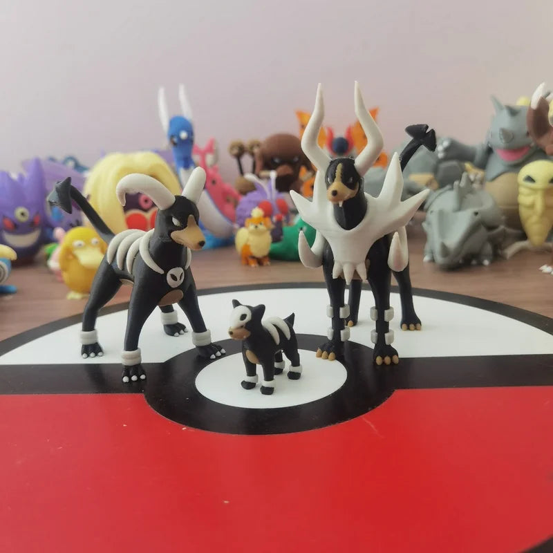 Figurines Pokémon de la ligne évolutive de Malosse, Démolosse et Méga-Démolosse.