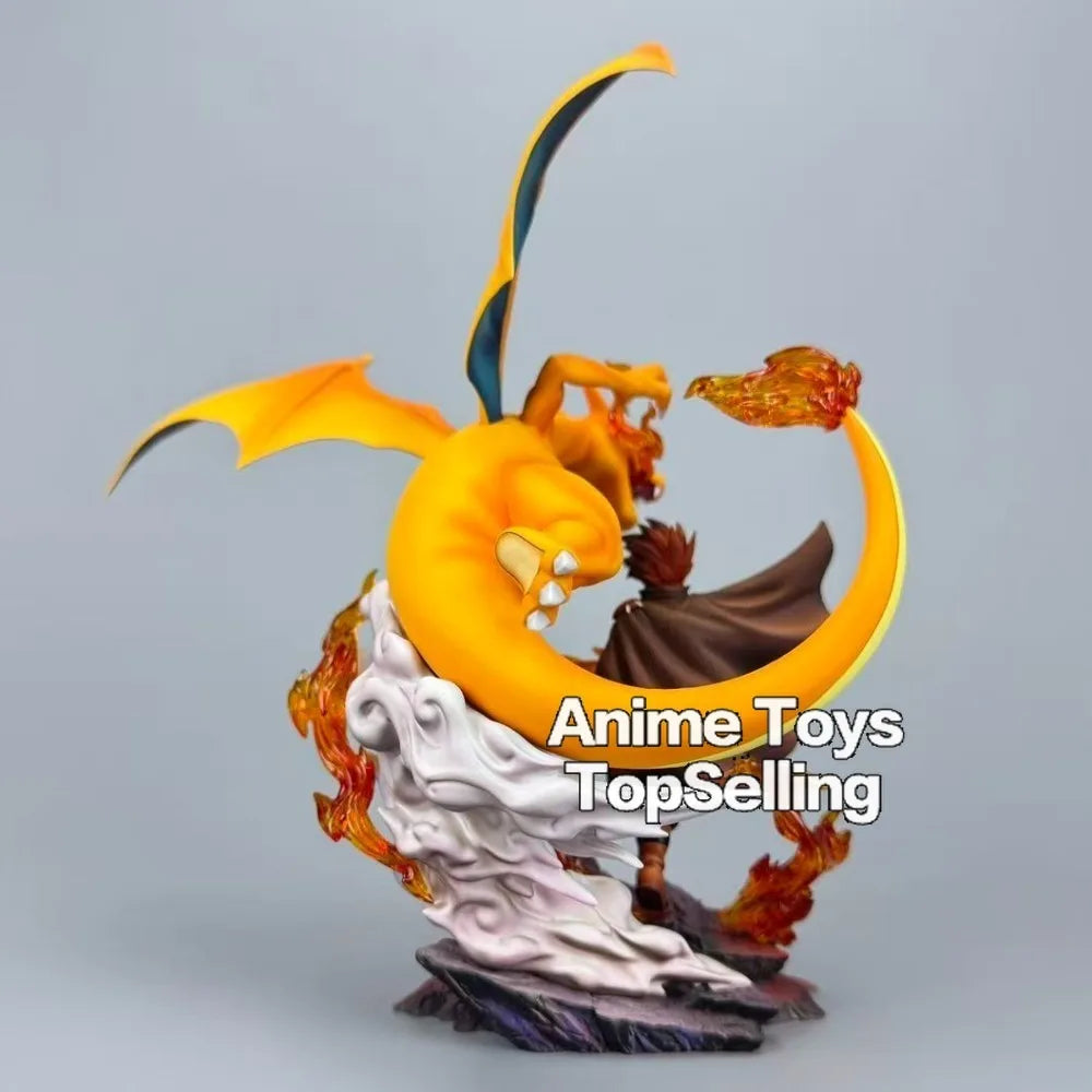 Superbe figurine de collection représentant Dracaufeu aux côtés de son dresseur avec effets de flammes