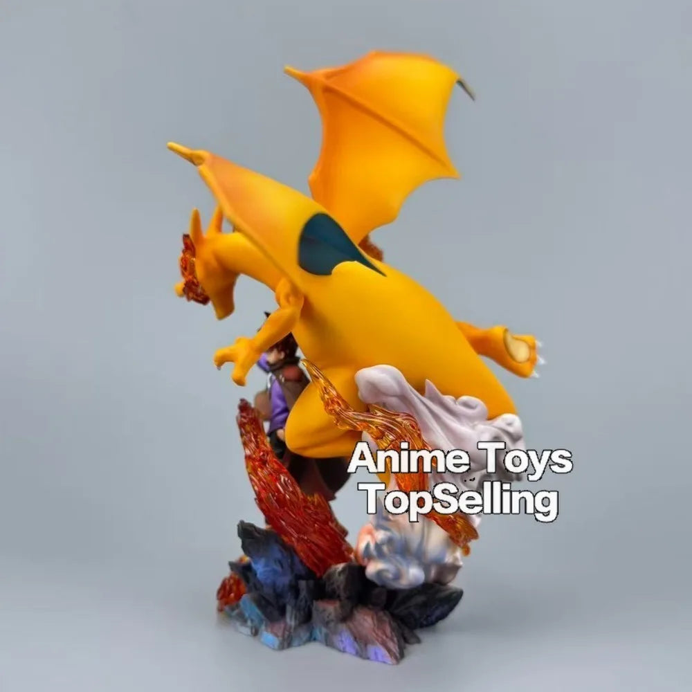 Superbe figurine de collection représentant Dracaufeu aux côtés de son dresseur avec effets de flammes