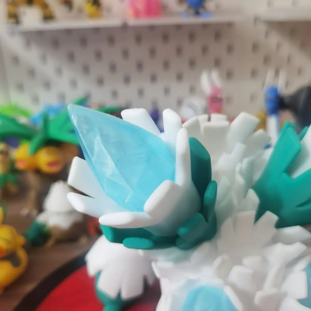 Figurines Pokémon de Blizzi, Blizzaroi et sa forme Méga-Blizzaroi.