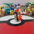 Figurines Pokémon du starter Feu de Johto : Héricendre, Feurisson et Typhlosion.