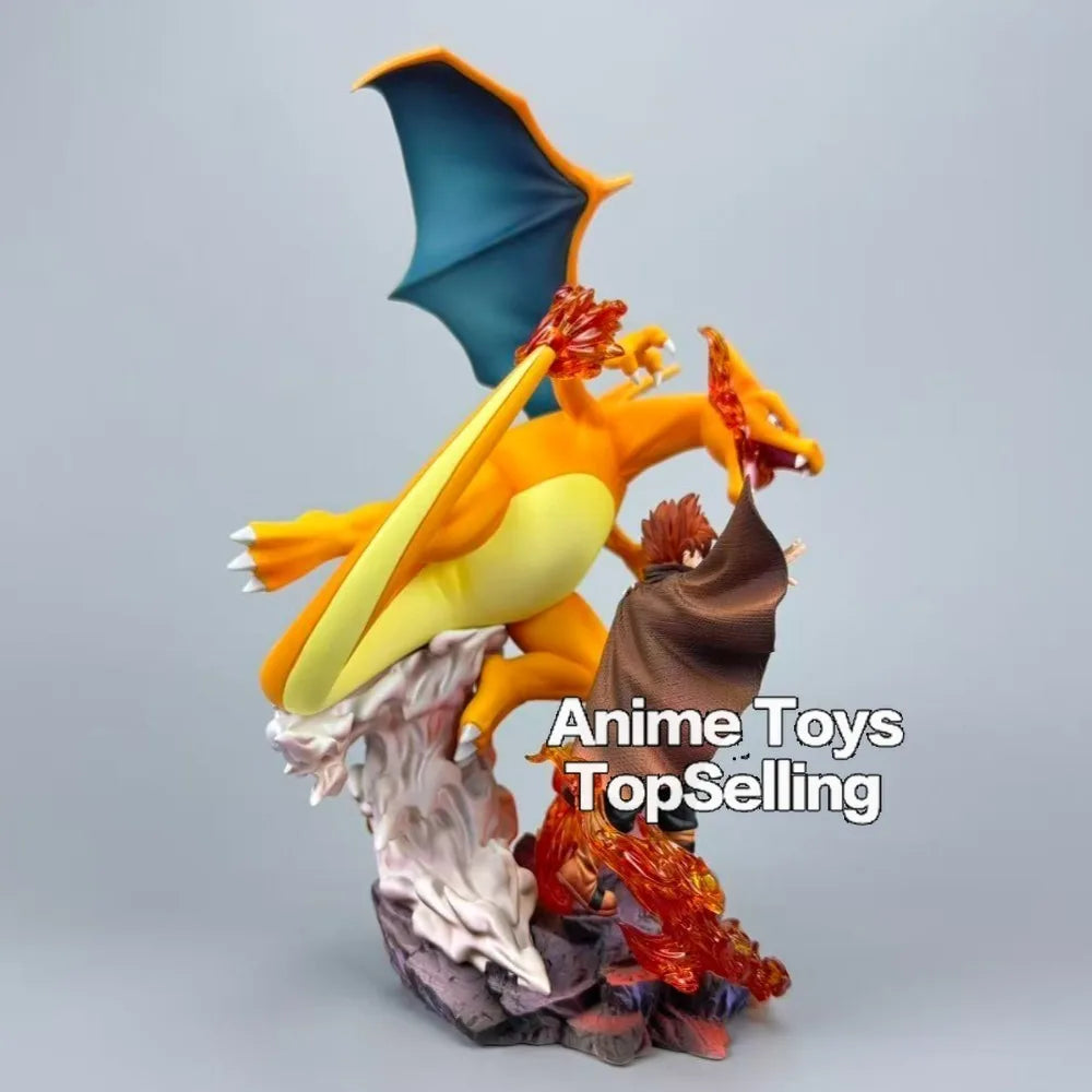 Superbe figurine de collection représentant Dracaufeu aux côtés de son dresseur avec effets de flammes