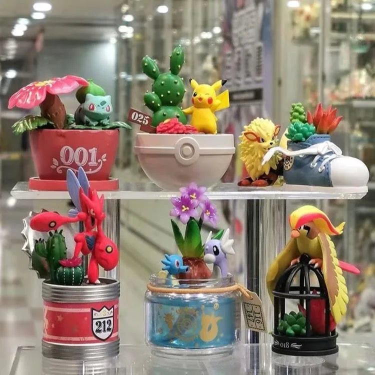 Lot de mini-figurines Pokémon variées présentées sur de petits socles thématiques d'environnement