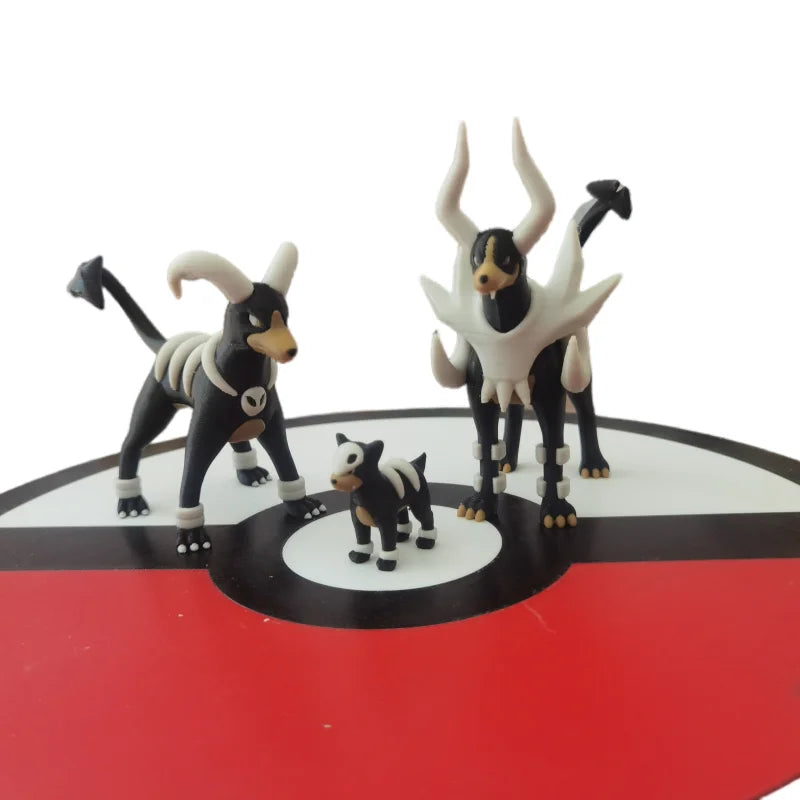 Figurines Pokémon de la ligne évolutive de Malosse, Démolosse et Méga-Démolosse.