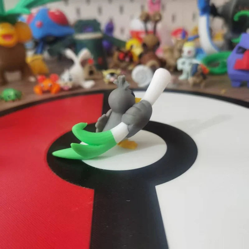 Figurines Pokémon de Canarticho et de son évolution Palarticho avec leur poireau.