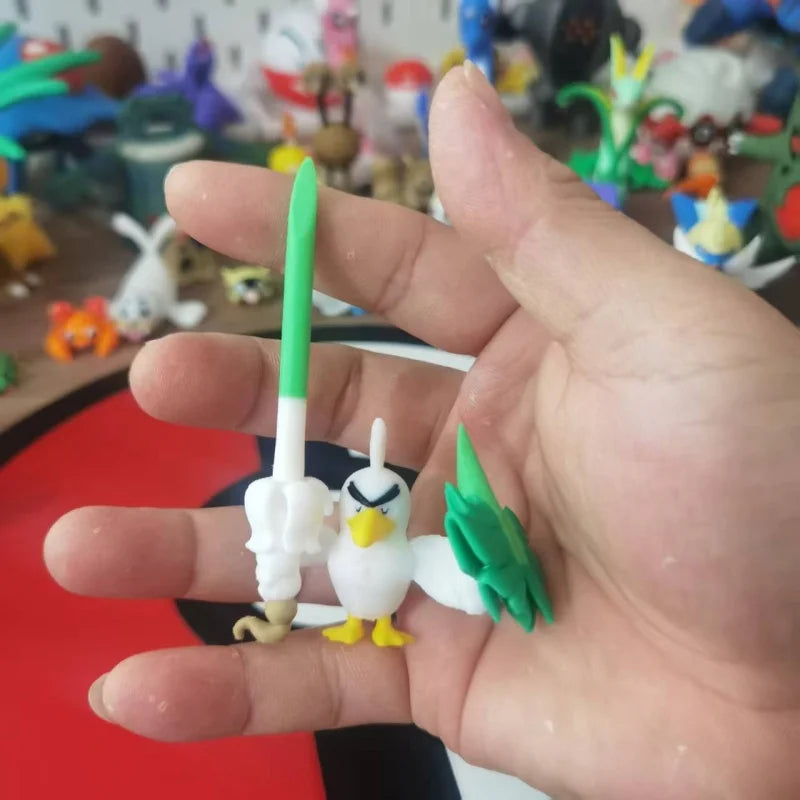 Figurines Pokémon de Canarticho et de son évolution Palarticho avec leur poireau.