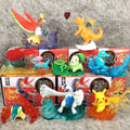 Ensemble de figurines Pokémon incluant des formes Teracristal translucides et des lignes évolutives