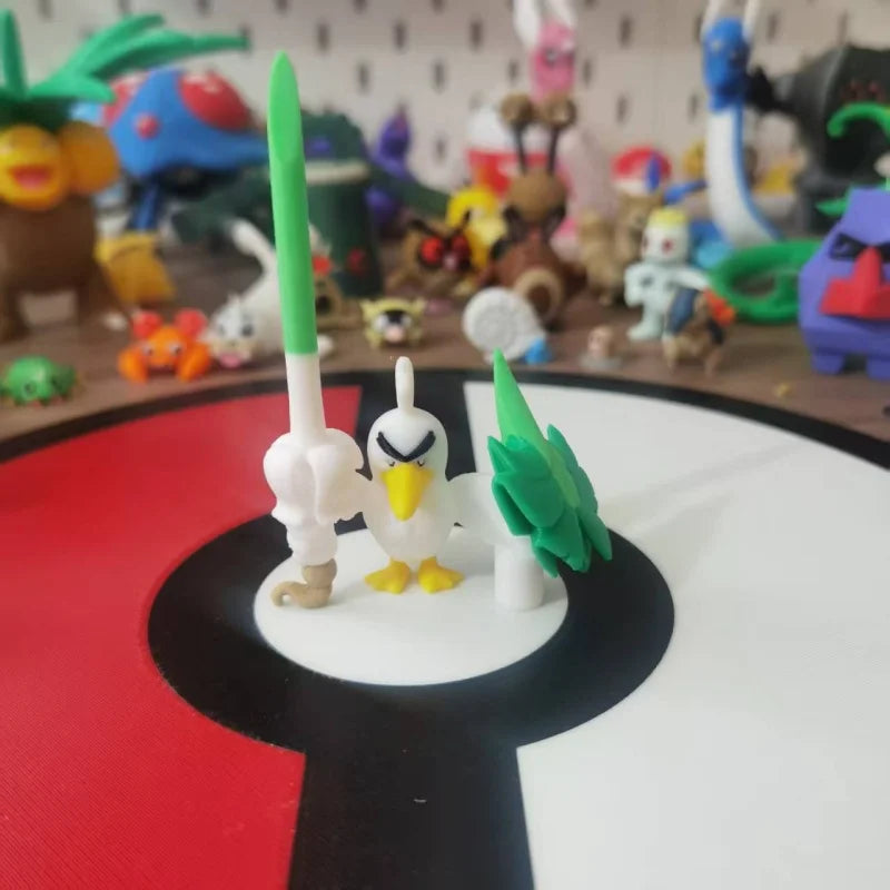 Figurines Pokémon de Canarticho et de son évolution Palarticho avec leur poireau.