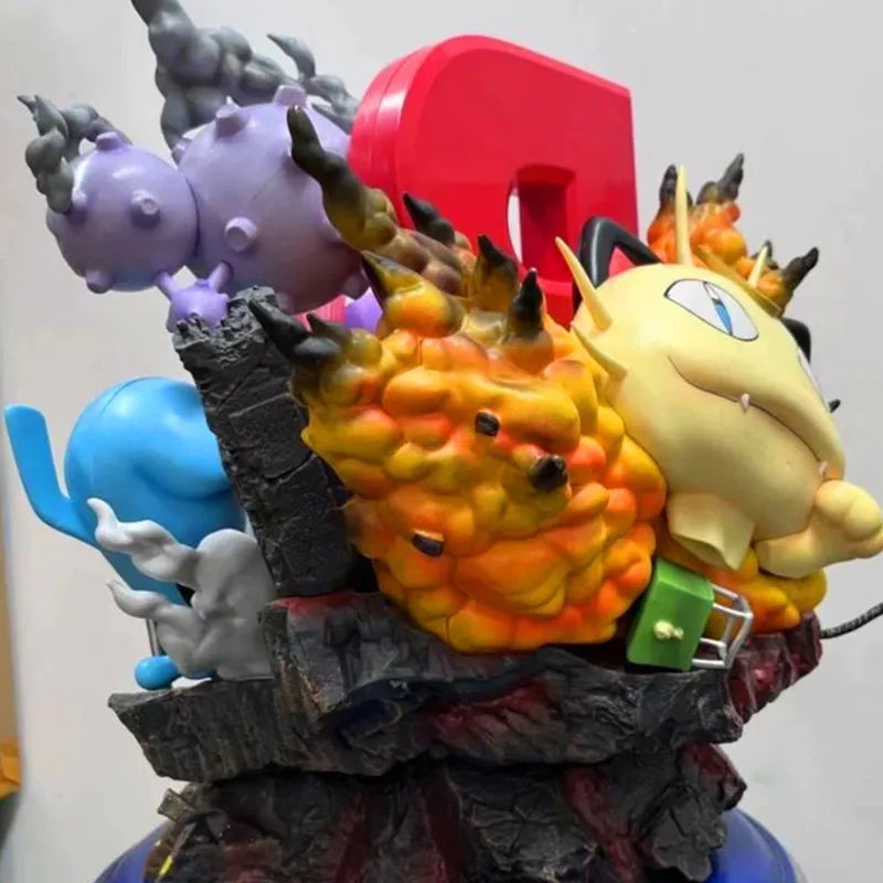 Grande statuette Pokémon représentant la Team Rocket avec Jessie, James, Miaouss et leurs Pokémon emblématiques sur un socle thématique détaillé