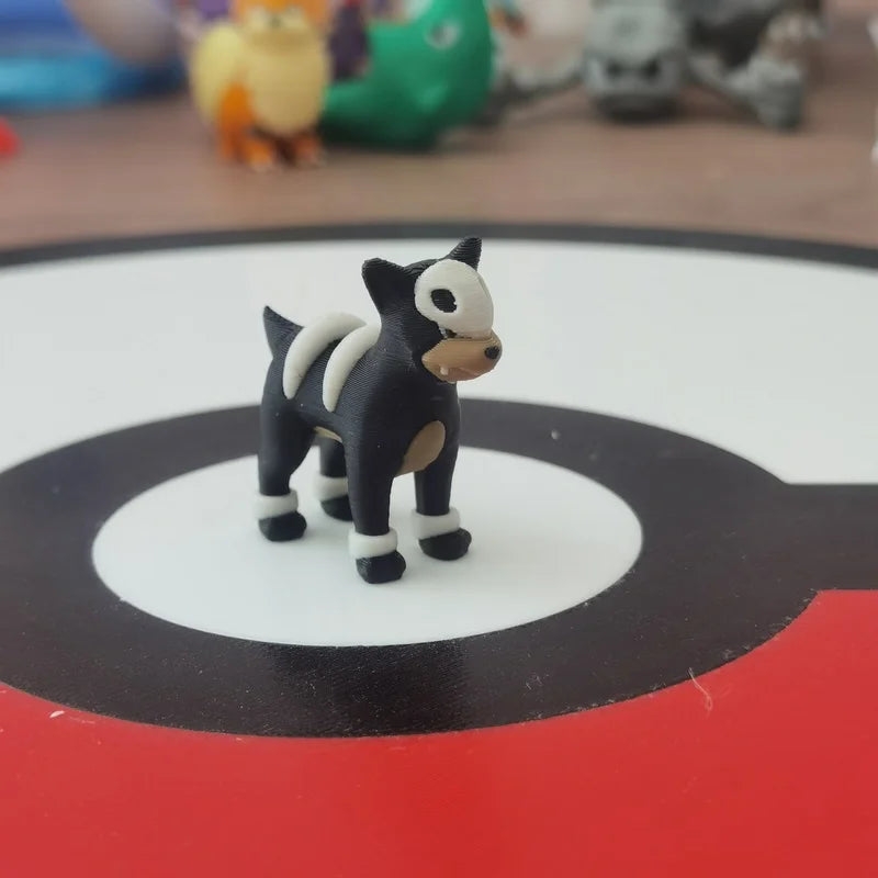 Figurines Pokémon de la ligne évolutive de Malosse, Démolosse et Méga-Démolosse.