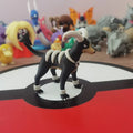 Figurines Pokémon de la ligne évolutive de Malosse, Démolosse et Méga-Démolosse.